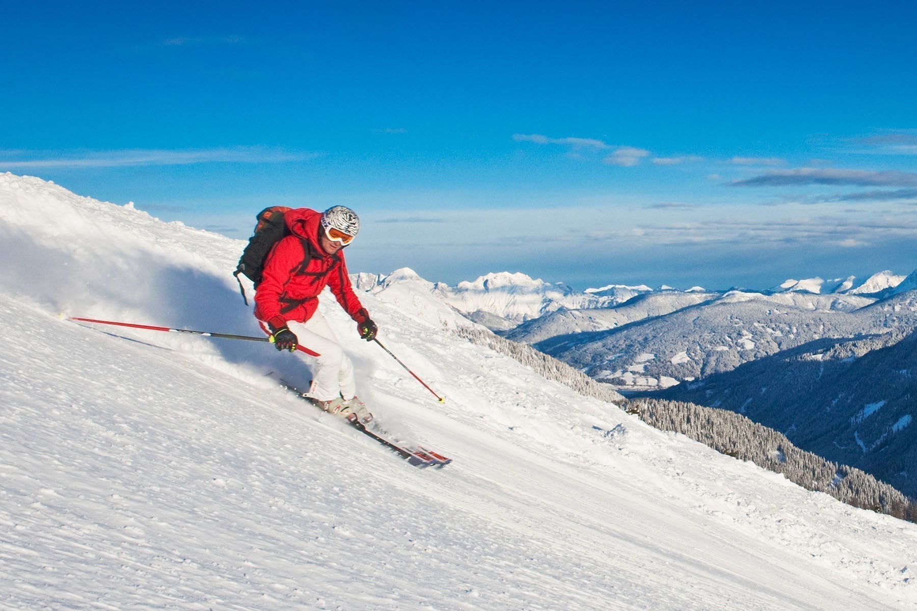 Man skiing down a snowy slope